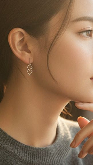 Close-up of a person wearing a geometric earring with a blurred background